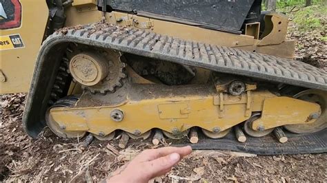 how to put tracks back on a avs skid steer|popped off track on steer.